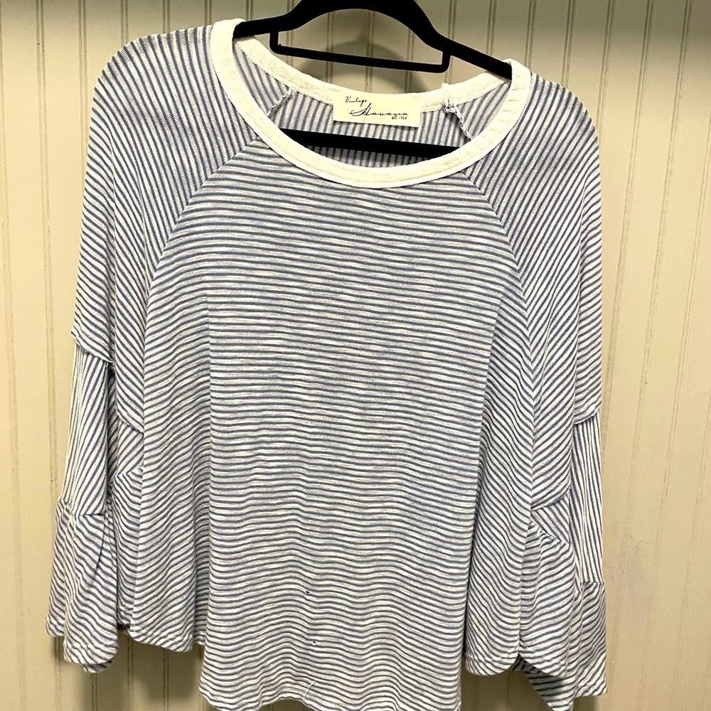Dolman sleeved blue and white striped top.